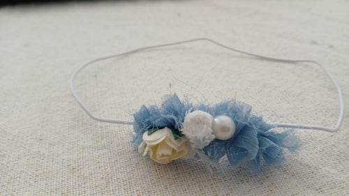 Blauwe haarband met parelmoer