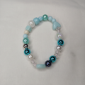 Armbandje met turquoise en parelmoer kralen voor meisjes